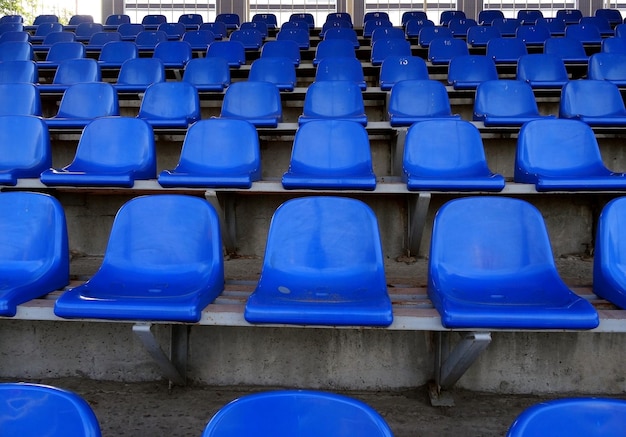 Plastic seats on the grandstand of sport stadium