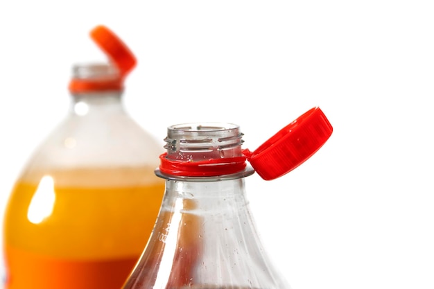 A plastic soda bottle with the new closing cap isolated on a white background recycle concept