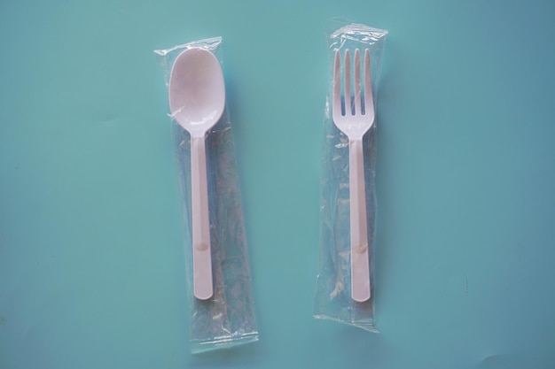 Plastic spoon and fork background.