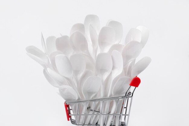 Plastic spoons in shopping cart