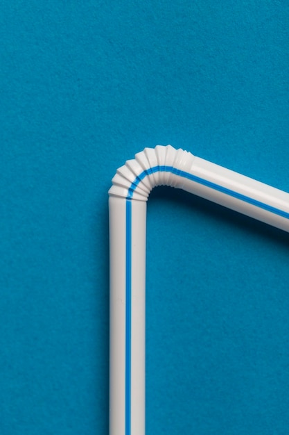 Plastic straws on a blue background