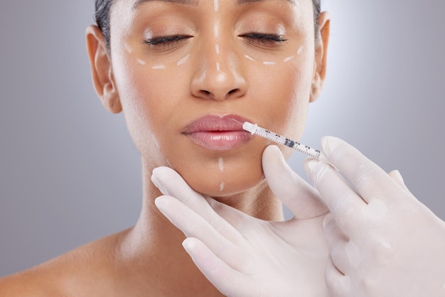 Plastic surgery aesthetic and lip filler with woman and injection for botox dermatology and beauty Pattern change and medical with model and syringe on grey background for collagen and cosmetics