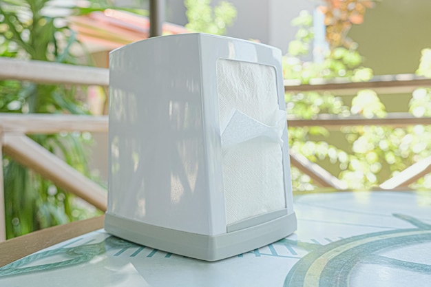 Plastic Tabletop dispenser for napkins on the table of a summer cafe