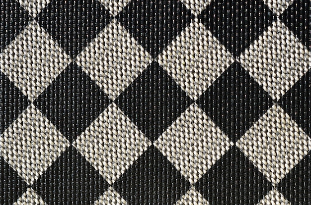 Plastic textuur in de vorm van een zeer kleine stoffen binding, geschilderd in zwart en grijs