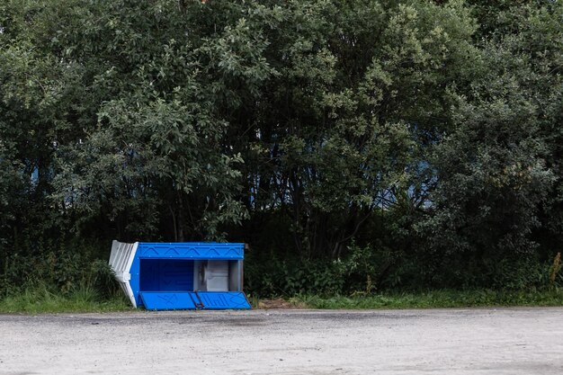 Plastic toilet cabin on the street The cabin of the dry closet lies in the park