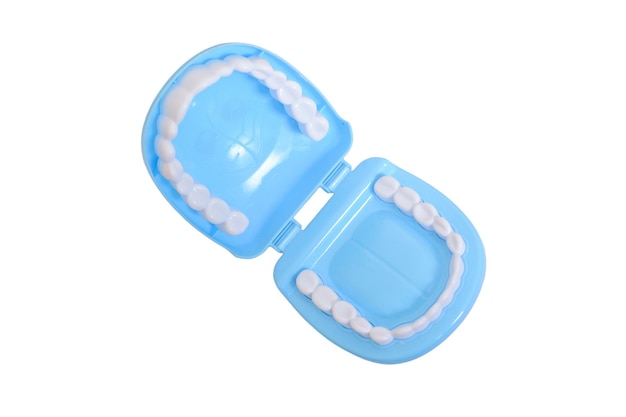 Plastic toy teeth isolated on a white background
