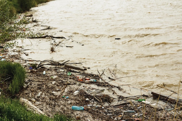 Photo plastic waste in the river pollution and the environment in the water an environmental problem