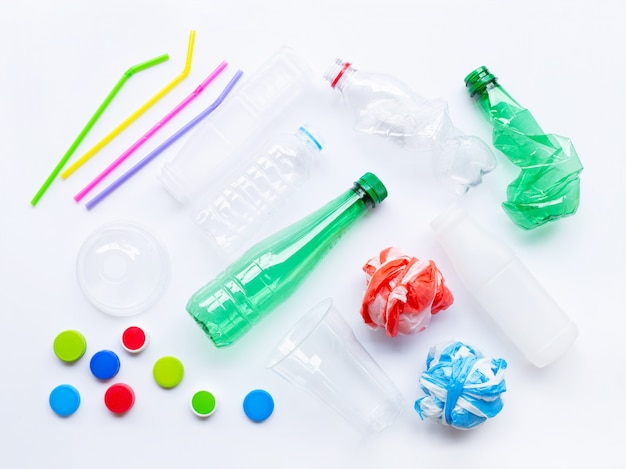 Photo plastic waste on white background.