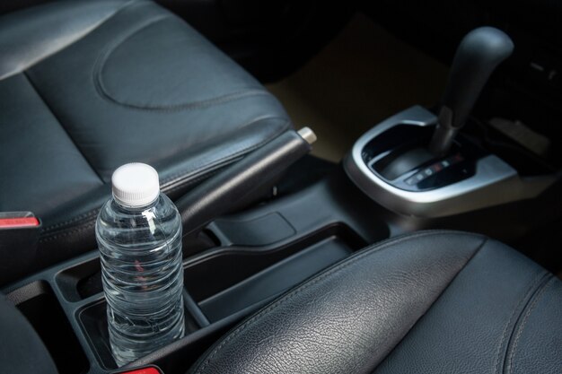 Plastic water bottle left in the vehicle while parking at\
outdoor carpark, plastic bottle with water is cause of fire and\
burning in a car. avoid parking at outdoor lots.