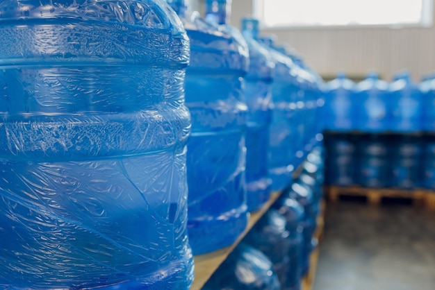 Plastic water bottles on conveyor and water bottling machine industry