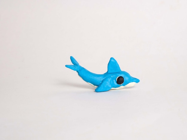 Plasticine craft blue dolphin Sculpting for children development of motor skills Marine life