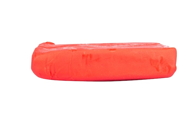 Plasticine red lump isolated on white background