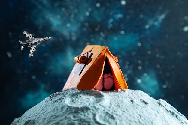 Plasticine tent on the Moon starry background