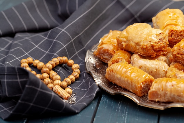 Plate of baklava dessert close up served on table