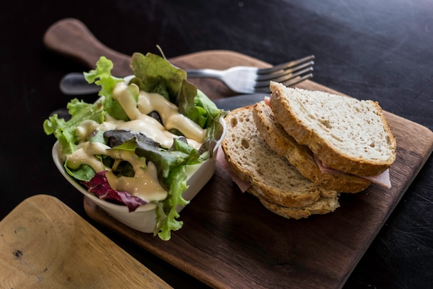 plate of caesar salad with folk 