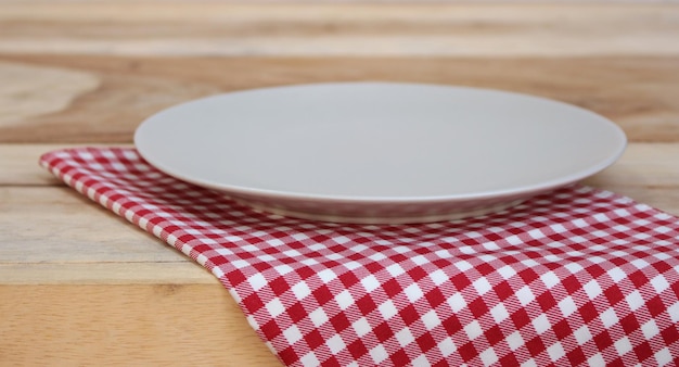 The plate on checkered tablecloth