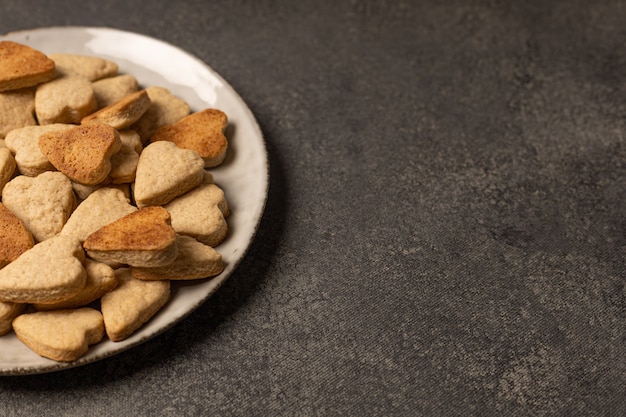 Plate of cookies on dark background