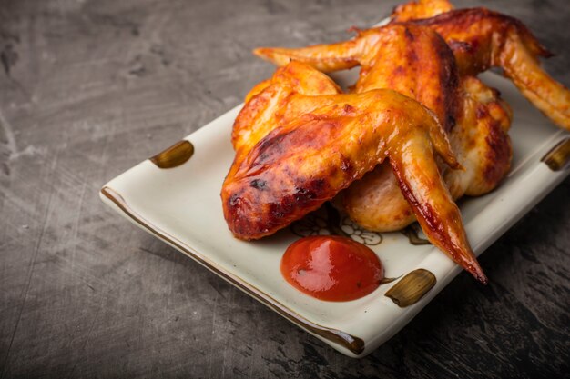 Plate of crispy grilled chicken wings