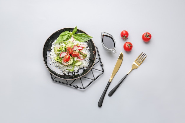 Plate of delicious rice salad with vegetables