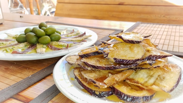 A plate of eggplant with a plate of eggplant on it