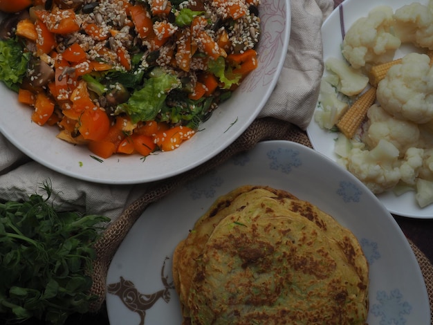 A plate of food with a blue flower design on it