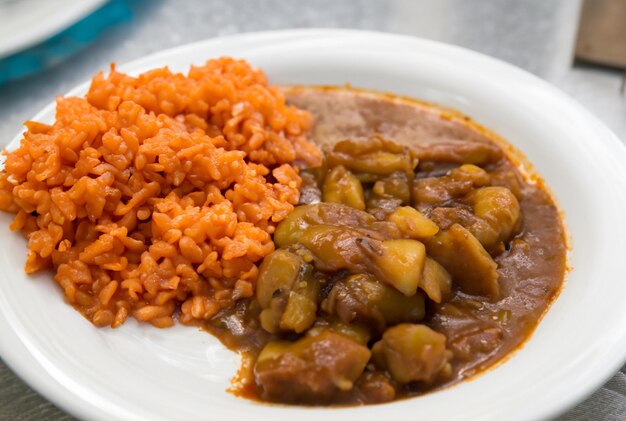 A plate of food with a bowl of food on it