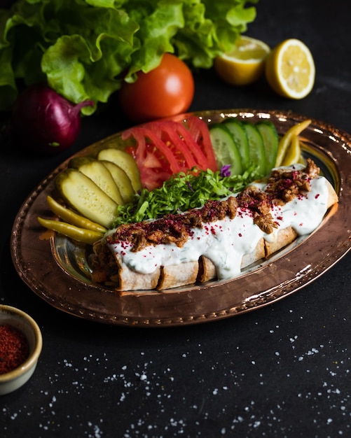 A plate of food with a chicken kebab on it