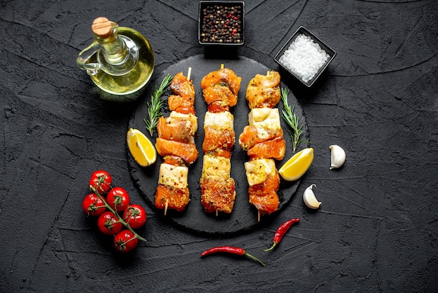 A plate of food with fish skewers on it