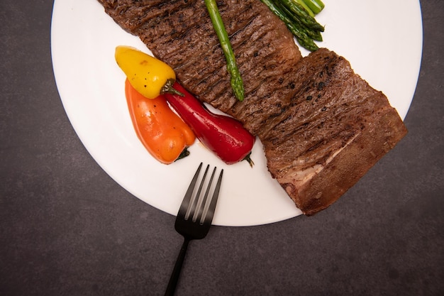 a plate of food with a fork and a knife on it