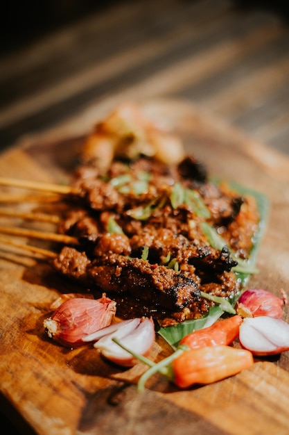 A plate of food with a meat dish on it