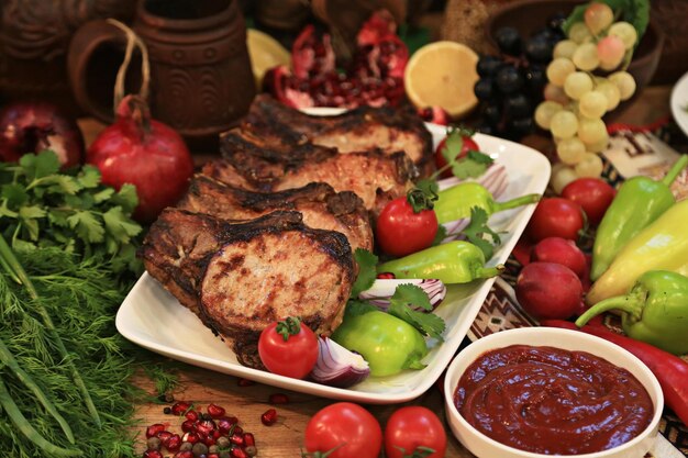 A plate of food with meat and vegetables on it