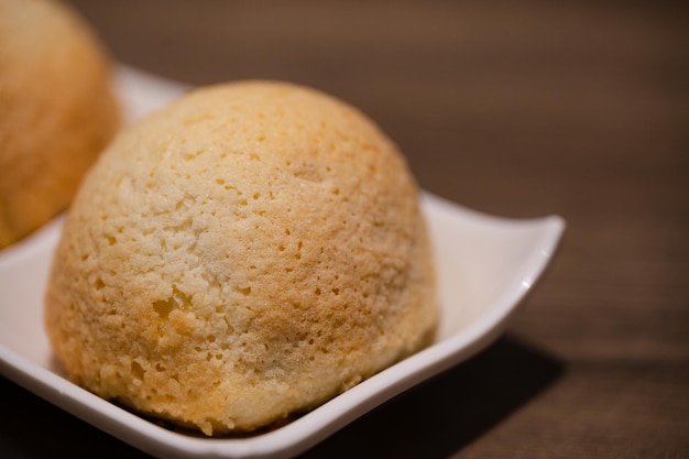 A plate of food with a pastry on it