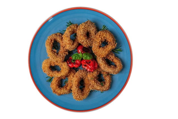 A plate of food with red trim and a red rim.