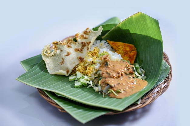 a plate of food with rice and a tortilla on it