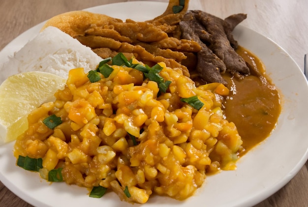 A plate of food with rice and vegetables and rice.