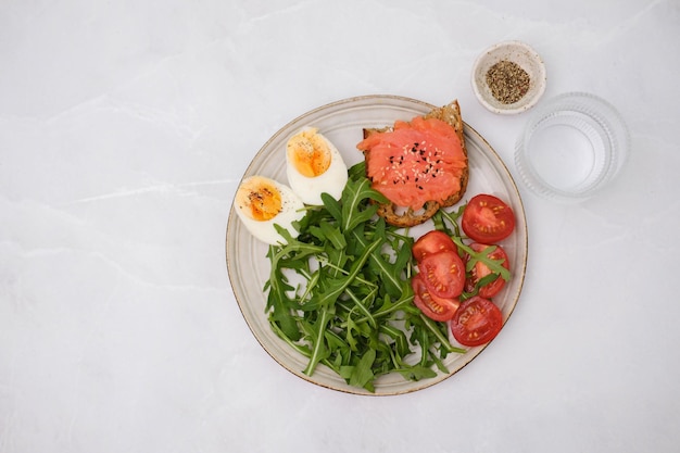 A plate of food with a salad and eggs on it