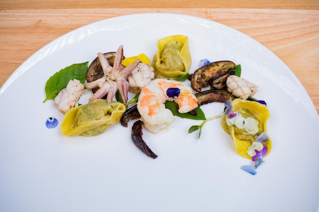 a plate of food with shrimp shrimp and vegetables