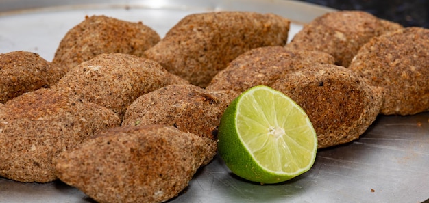 A plate of food with a slice of lime on it