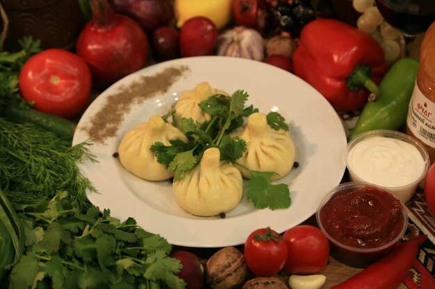 A plate of food with three dumplings on it