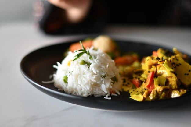 A plate of food with a white rice on it