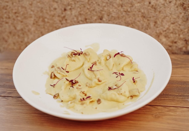 A plate of fresh homemade Italian pasta with typical Mediterranean sauces