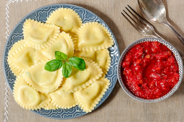 Plate of fresh ravioli with tomato sauce