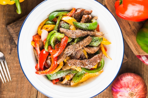 A plate of fried beef cubes with green pepper