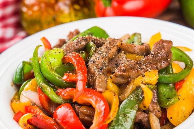 A plate of fried beef cubes with green pepper