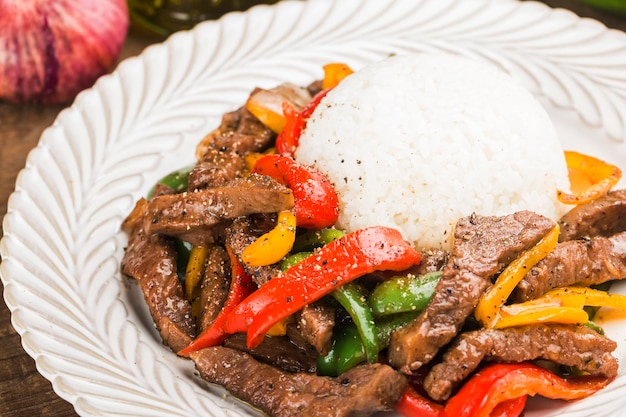 A plate of fried beef rice with green pepper