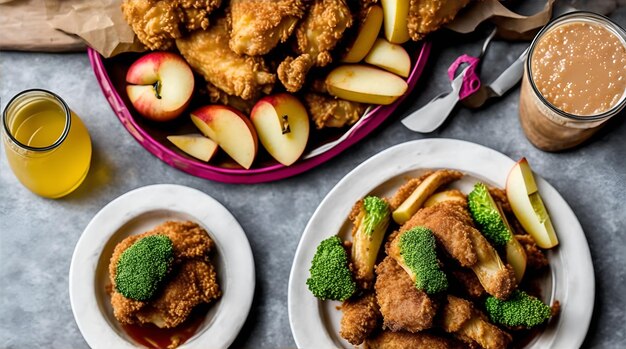 Photo a plate of fried chicken and a basket of apples