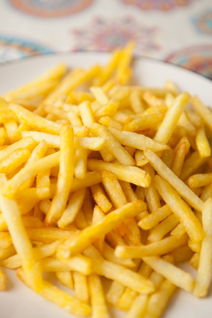 Plate full of crispy fries  