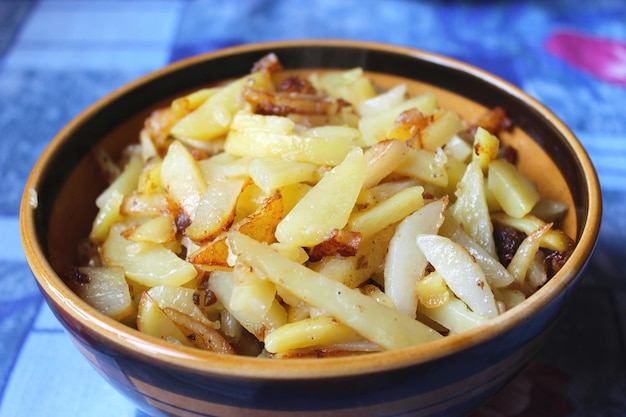 Plate full of tasty chips standing on the table