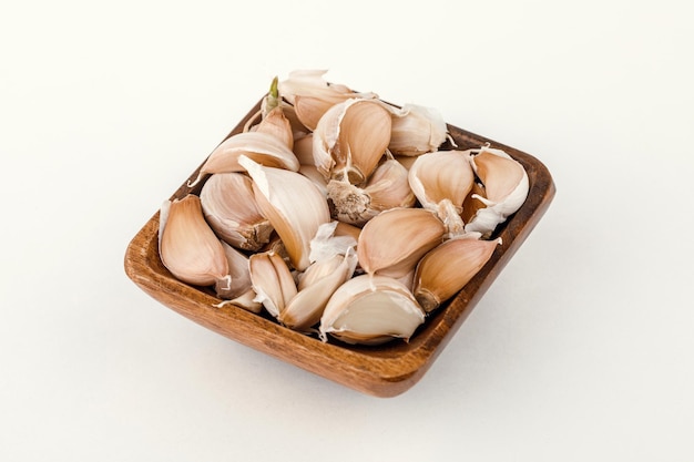 A plate of garlic isolated on white background