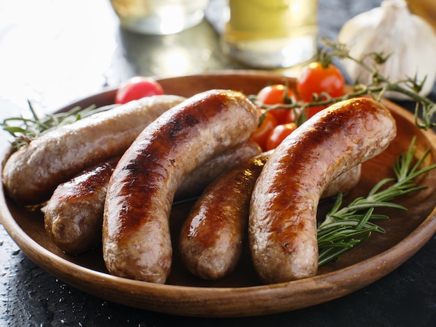 Plate of german bratwurst sausages with herbs